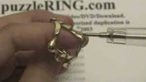 Rotate the other upper band clockwise until the knot faces downward. Puzzle Ring Solution For 4 Band Large Puzzle Rings Youtube