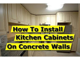 As long as you got the measurements down, hgtv's chip wade proves it's not all that hard. How To Install Kitchen Cabinets On Concrete Brick Walls Drywall Youtube Installing Kitchen Cabinets Installing Cabinets Diy House Renovations