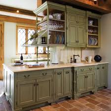 Moreover, this design involves farmhouse characteristics such as the rustic plate holder, reclaimed island table extension, and many flowery touches. Green Cabinets Design Ideas Pictures Remodel And Decor Distressed Kitchen Cabinets Green Kitchen Cabinets Distressed Kitchen