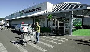 woolworths reports 100m net profit