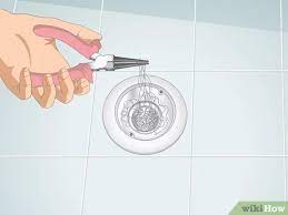 Here is what you'll need!how to remove hair from the drain materialswire hangerpliers instructionscompletely unfold a wire hanger so it is a relatively strai. 3 Ways To Clean Hair Out Of A Shower Drain Wikihow