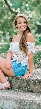 Senior Picture Ideas For Girls White Top And Blue Shorts Green Background At The Park Myrtle Beach Sen Senior Portraits Girl Girl Poses Girl Senior Pictures