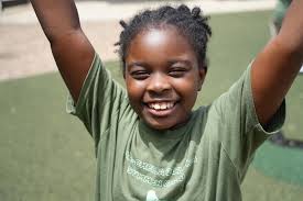 Presentation of a Helpful Check to Kids at a Charity Event