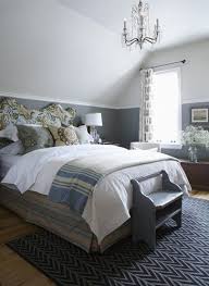 The Touches Of Lavish Old World Style Blend Beautifully With The Modern Inviting Colours And Finishi Sloped Ceiling Bedroom Guest Bedroom Decor Bedroom Design