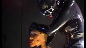 Two sexy lesbians full encased in latex suits have fun in her rubber skins  - Part 2