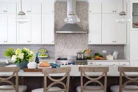 Digging these gray cabinets as potential stain for our cabinets. Painted White Kitchen With Dark Grey Stained Walnut Island Crystal Cabinets