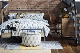 Industrial black furniture and cute pink textiles in a teenage student's modern bedroom interior with cozy metal frame bed and workspace. Get The Industrial Look Modern Home Decor Argos