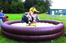 Our Mechanical Bull Spins And Bucks Simulating Real Bull Movement Our Operator Controls The Level In Which Mechanical Bull Company Picnic Games Company Picnic