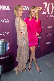 This is the untold true story that shaped the woman, and the iconic. Paris And Nicky Hilton Attend The 2019 Footwear News Achievement Awards At The Iac Building In