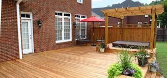 An outdoor sofa and accent table become the furniture which enhances the comfort of the deck. 30 Hot Tub Deck Ideas Sebring Design Build Design Trends