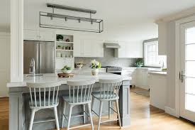 Blue provides a needed contrast for stark white kitchens and creates a slightly darker, more homey feel. Gray Windsor Counter Stools At Gray Kitchen Island Transitional Kitchen