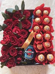 Basket arrangement of yellow flower like roses , gerberas and carnation along with celebration chocolate pack. Flowers And Chocolates Bouquet With Wine In A Box Food Drinks Local Eats On Carousell