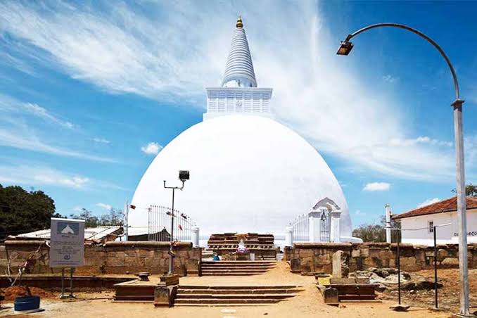 Mirisawetiya Dagoba 59 metres Dutugamunu sacred spear Vijithapura Tissa Wewa shoreline sunrise reflection Anuradhapura