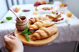 Table set up for continental breakfast: Premium Photo Continental Breakfast Table Served With Traditional French Croissant In Woman Hand