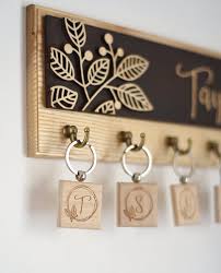 The next key rack idea needed very little effort to complete. Key Holder For Wall Entryway Organizer Key Rack Last Name Sign Etsy Wall Key Holder Laser Engraved Ideas Key Holder