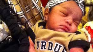 Purdue's Sterling Carter with his new born daughter Aria