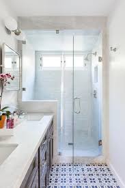 White Blue And Gray Mosaic Floor Tiles Are Fitted In A Long Bathroom And Lead To A Seamless Glass Shower Boa Grey Bathrooms Trendy Bathroom Bathroom Flooring
