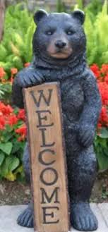 This chainsaw carved bear is super cute and stands around 14inches and 6  inches wide its a super nice little bear and would be a great gift for your  family or loved