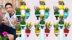 Amazing Plastic Bottle Tower Pots Diy Plastic Bottle Garden Ideas For Home Bottle Garden Plant Pot Diy Diy Plastic Bottle