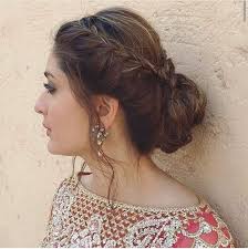 From there, section off the hair into two separate ponytails, and twist them together from the base to the ends. Best Bun Hairstyles Found On Bollywood Celebrities