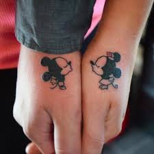 Black outline little tinkerbell tattoo design for wrist. Peter Pan And Tinkerbell Silhouettes Disney Couple Tattoos Popsugar Love Uk Photo 5