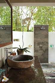 Creating unique one of a kind complete bathroom settings for lovers of rustic stone and wood Outside Bathroom Outdoor Bathroom Design Outdoor Bathrooms Balinese Bathroom