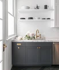 Natural Light Flows In Front A Window In This Gorgeous White And Gray Contemporary Kitche Contemporary Kitchen Dark Wood Kitchen Cabinets Wood Kitchen Cabinets