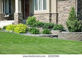 Stock Photo Landscaping And Retaining Wall At A Residential Home Landscaping Retaining Walls Front Yard Landscaping Design Backyard Landscaping