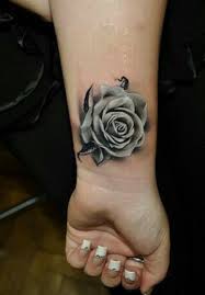 This tattoo from cuded.com is a bit darker than most colored rose tattoos. Pin On Tattoo Ideas