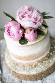 You can purchase floral foam in the floral supply department at the crafts store. Naked Wedding Cake Decorated With Fresh Flowers By Ruth Black Cake Wedding Cake Stocksy United