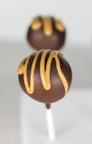 classic buckeye candies in cake pop form in these buckeye cake pops peanut butter cake frosting is dipped in chocola buckeye cake cake pop recipe cake pops