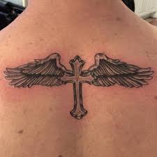 Incorporation of wings to the cross tattoo carry some element of hope and freedom. Cross With Wings Tattoo Design Novocom Top