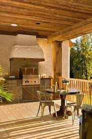 Barbecue grill and prep station. Modern Outdoor Kitchen Designs With Beautiful Dining Areas Under Roofs
