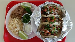 12 flour tortilla with your choice of steak or chicken, grilled onions, jalapenos, tomatoes, refried beans, rice, covered with cheese dip and your choice. Don Ramon S Taco Shop Fayetteville