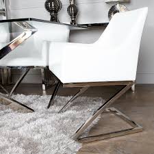 These stylish dining chairs have a contemporary appeal which is easy to match with the existing colour scheme in your restaurant, bistro or hotel. Set Of 2 Debonaire White Faux Leather Dining Arm Chairs Picture Perfect Home
