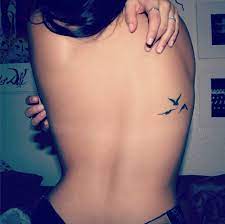 The Woman Back Tattoo Is One Of The Locations Of The Most Requested Body The Back Allows The Widest Possible A Discreet Tattoos Tattoos Bird Tattoos For Women