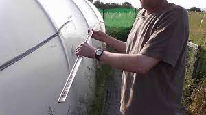 The authors sealed the plywood walls. How To Make A Cheap Simple And Easy Polytunnel Gutter Water Collecting Device Youtube
