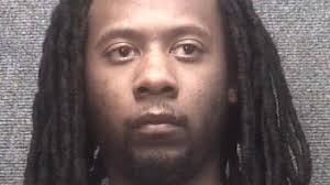 Man charged in connection with attempted murder after building sprayed with  bullets