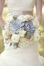 How do you find out what kind (and colors) of flowers are in season during your wedding month? Bouquets D Weddings Succulent Bouquet Wedding Winter Wedding Flowers Wedding Bouquets