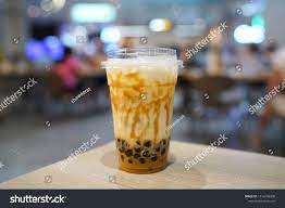 Bubble Milk Tea Holding A Plastic Glass Of Fresh Milk With Salted Egg Sauce And Hot Black Pearl Boba On Blurred Back Bubble Milk Tea Milk Tea Plastic Glass