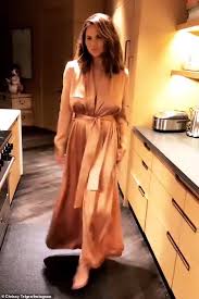 I'm so proud of her. Chrissy Teigen Shows Off Her Modeling Skills In Rose Gold Robe While In Her Kitchen Daily Mail Online