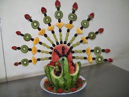 Strawberry Kiwi Orange And Grapes Skewered To Give A Beautiful Watermelon Peacock Food Art Fruit Art Fruit Displays
