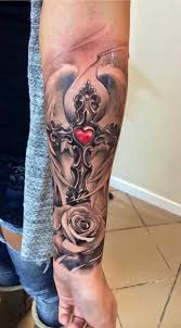 Memorial cross and names tattoos on lower arm. 85 Best Forearm Cross Tattoo Images Design Ideas