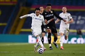 Leeds united's mateusz klich is confronted by aston villa's conor hourihane after he scores his side's first goal while villa's jonathan kodjia was down injured. Lwqmgc1mdh27nm