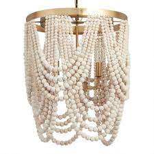 Our chandelier is the perfect accent piece over a bed or in a seating area. Whitewash Wood Draped Bead 4 Light Chandelier World Market