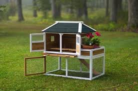 Find out how garden herbs can be very beneficial for your chicken coop! Chicken Coop With Herb Planter The Chicken Outfitter