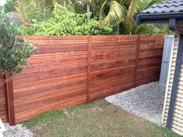 Instructions on replacing slats for blinds, removing slats, adjusting blinds ladders, troubleshooting so fido got his head caught in your horizontal blinds and broke a couple slats trying to get loose. Timber Slat Fence How To Build An Inexpensive Slat Wood Privacy Fence