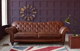 In true chesterfield style this gorgeously grand sofa has a low, rolled back with deep buttoning, and decorative scroll arms with studding detailing. Arundel Vintage Leather Sofa Chesterfield Company