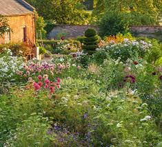 Kelmarsh Hall In Northants Is A Wonderful Place To Visit With It S Packed Late Summer Borders And Walled Gardens Charming Garden Garden Wall Gorgeous Gardens