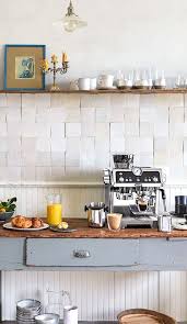 Transitional kitchen with a coffee station in an appliance garage cabinet brings a unique look with a pull out tray shelf. 26 Home Coffee Station Ideas To Help You Quit Starbucks Posh Pennies